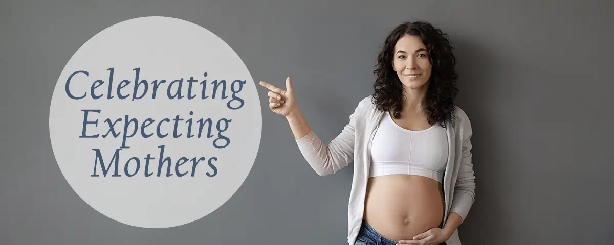 Celebrating Expecting Mothers with Pregnant Women pointing at caption